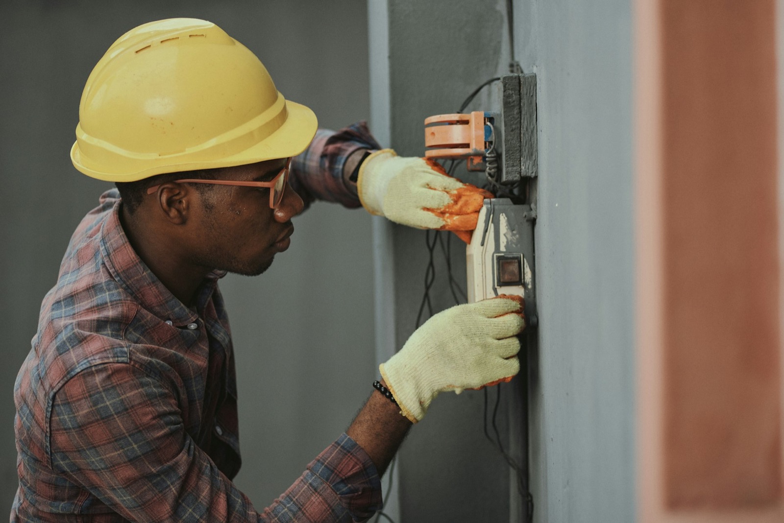 Licensed electrician working on a residential breaker panel and service entry in London, Ontario